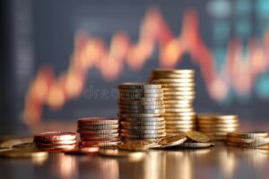 Come Incidono I Tassi di Interesse della Banca Centrale Europea sull'Economia 17 moneta e banconote con grafici economici sfocati
